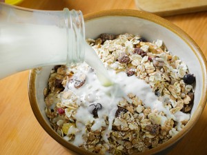 Berlin, Germany - October 24: Muesli in a bowl is doused with milk from a bottle on October 24, 2015 in Berlin, Germany. (Photo by Thomas Trutschel/Photothek via Getty Images)