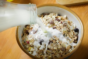 Berlin, Germany - October 24: Muesli in a bowl is doused with milk from a bottle on October 24, 2015 in Berlin, Germany. (Photo by Thomas Trutschel/Photothek via Getty Images)